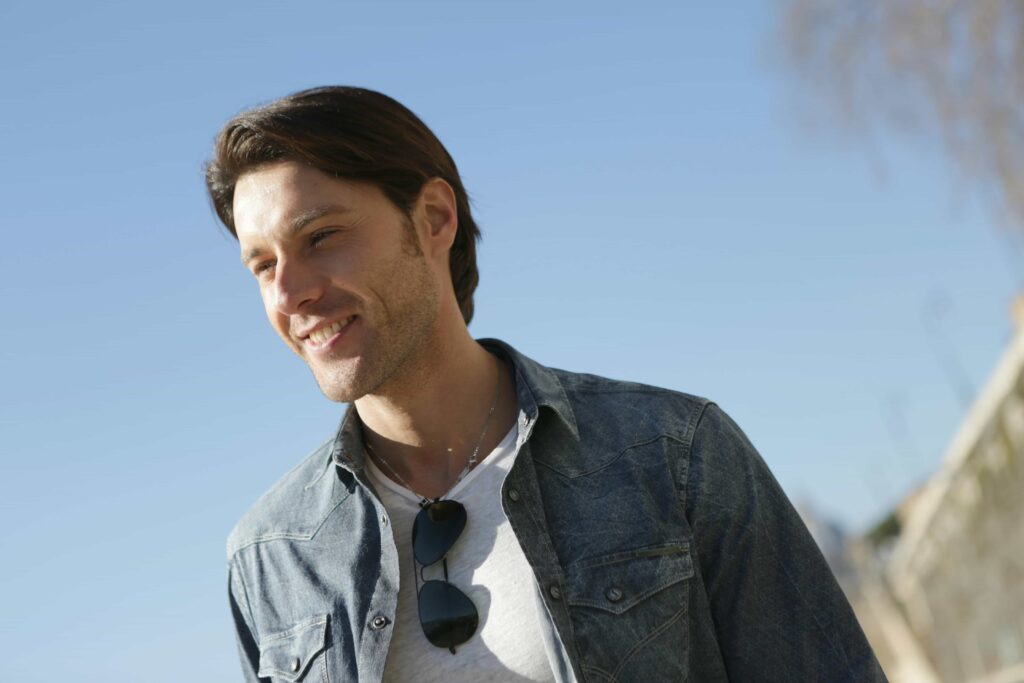 Can You Get Braces With Cavities or Fillings? 1 man smiling outside